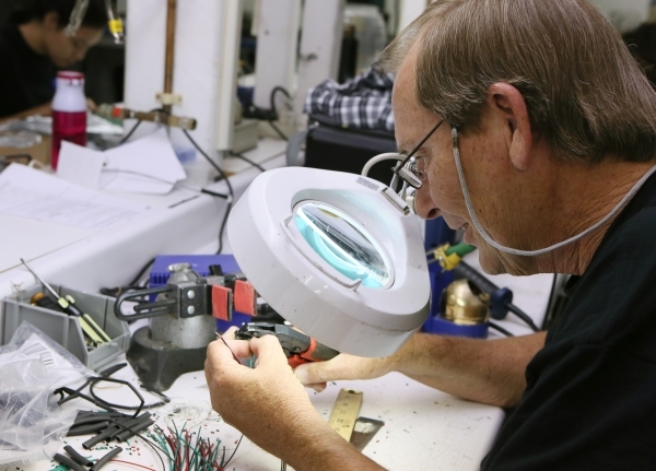 Richard Hatcher works in the manufacturing facility at Kiesub Electronics. (Ronda Churchill/Las Vegas Review-Journal)