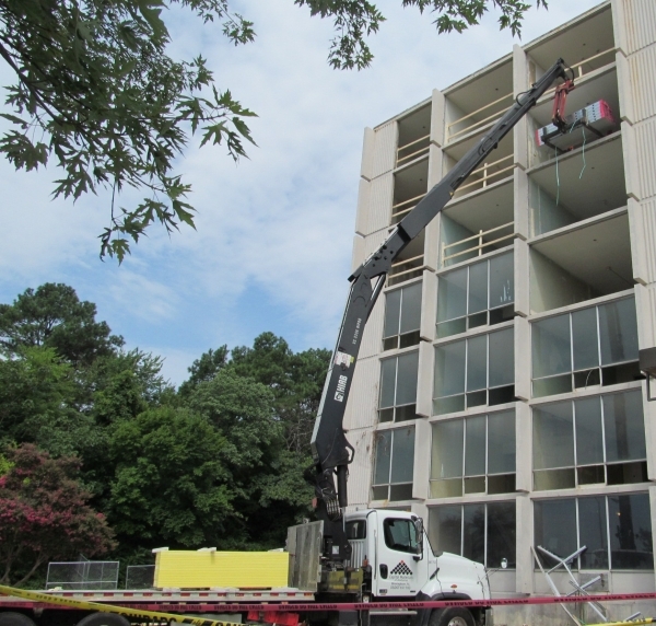 Crews work to convert a former hotel in Birmingham, Ala., into a senior housing facility being developed by Las Vegas-based real estate developer John Yang. COURTESY PHOTO
