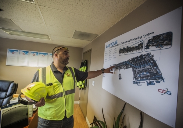 Len Christopher, general manager of Republic Services, shows a diagram of the Southern Nevada Recycling Complex, 333 West Gowan Road, North Las Vegas, on Tuesday, Sept.15, 2015. Republic Services& ...