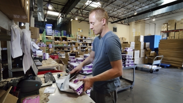 Scott Boehm, internet packing manager at Pediped Footwear, is shown filling orders in the company warehouse at 1191 Center Point Drive in Henderson on Thursday, Oct. 8, 2015. (Bill Hughes/Las Vega ...