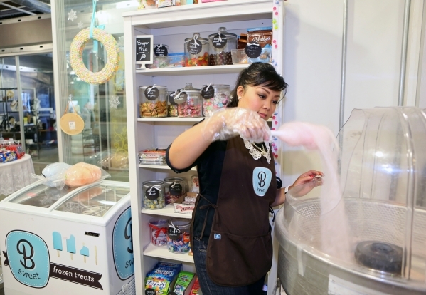 Arlene Bordinhao, co-owner of B Sweet Candy Boutique, makes cotton candy at B Sweet Candy Boutique Friday, Nov. 6, 2015, in Las Vegas. The local sweets shop and catering business headquarters is l ...