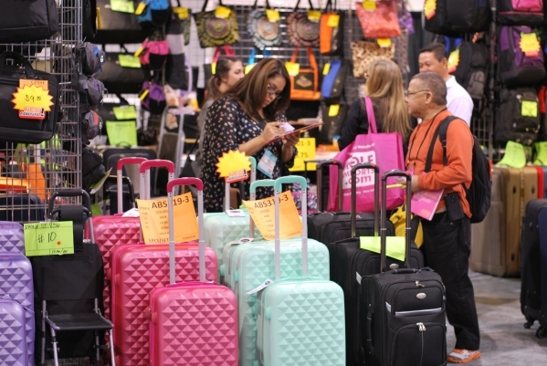 Retail buyers prowl the luggae aisles at a 2015 ASD Market Week. (Courtesy)
