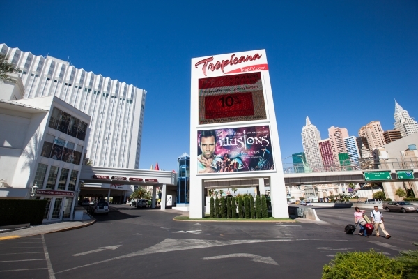 People pass by the Tropicana hotel-casino in Las Vegas on Wednesday, April 29, 2015. Penn National Gaming announced an agreement to acquire the Tropicana for $360 million. (Chase Stevens/Las Vegas ...