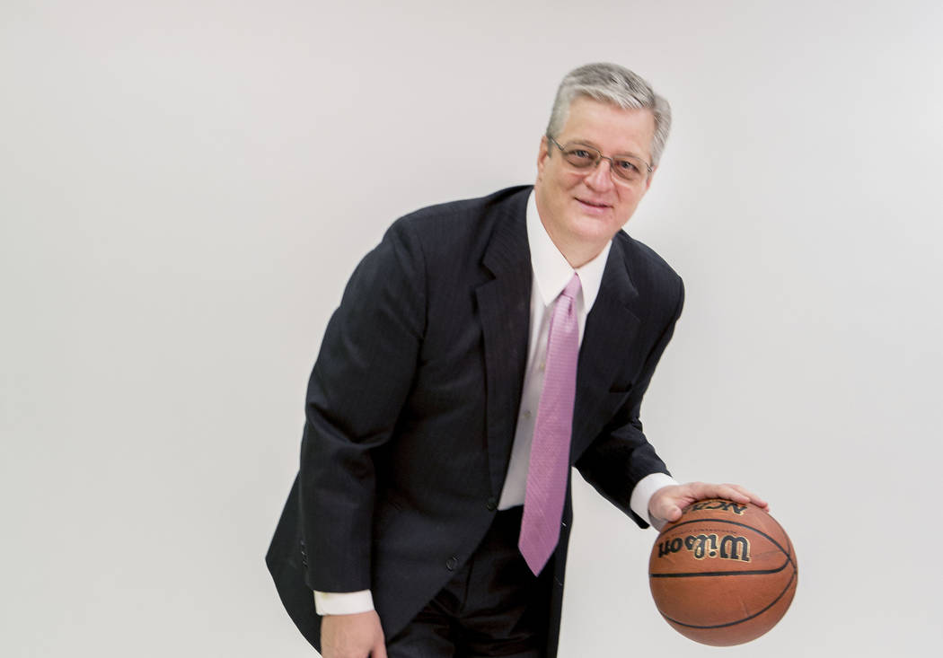 Doug Waggoner, president and CEO of Resolution PI., dribbles a basketball at the Las Vegas Review-Journal studio, Las Vegas, Feb. 20, 2017.  (Elizabeth Brumley/Las Vegas Review-Journal) @EliPagePhoto