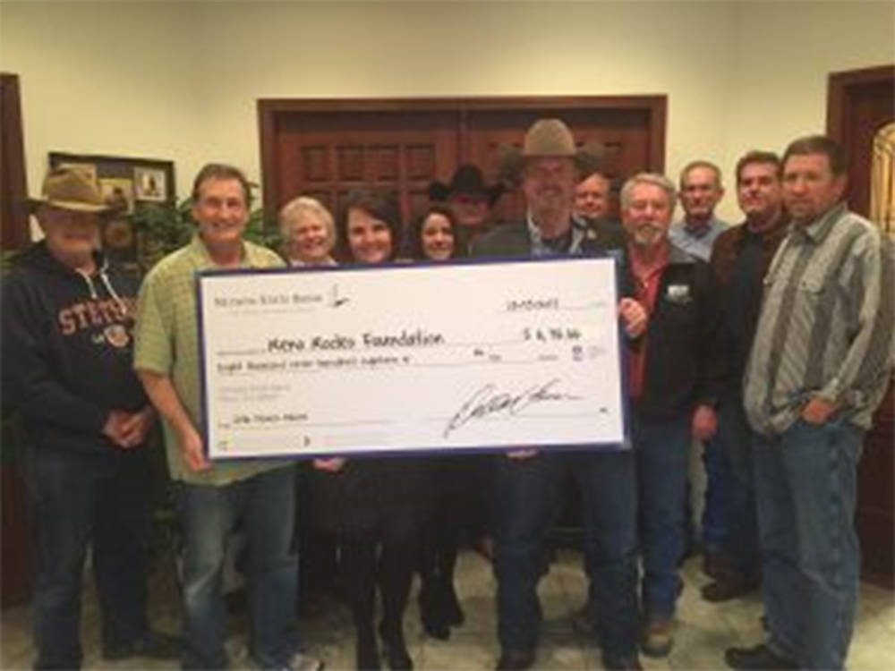 Nevada State Bank’s Debby Herman presents check to the Reno Rodeo Foundation. (Courtesy)