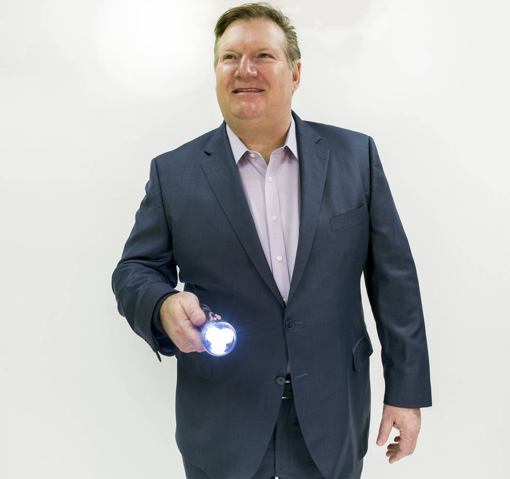 Goettl Air Conditioning owner Ken Goodrich holds his company's signature flashlight at the Las Vegas Review-Journal photo studio, Las Vegas, Tuesday, Feb. 28, 2017.  (Elizabeth Brumley/Las Vegas R ...
