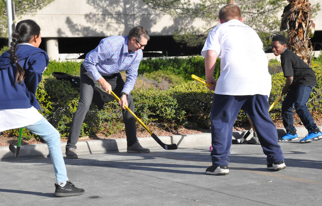 Murray Craven, senior vice president of the Vegas Golden Knights and former National Hockey League center, plays street hockey with children from After-School All-Stars Mar. 7 at AutoNation Toyota ...