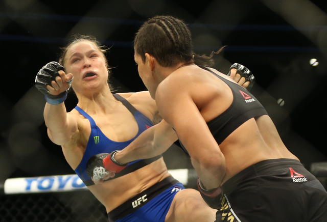 Amanda Nunes lands a strike against Ronda Rousey during their bantamweight championship fight at UFC 207 at T-Mobile Arena on Friday, Dec. 30, 2016, in Las Vegas. Benjamin Hager/Las Vegas Review-J ...