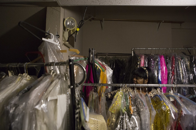 Manager Glenda Scott makes her way through the second floor of Williams Costume, where thousands of costumes are stored, looking for a light switch on Thursday, Feb. 16, 2017, in Las Vegas. (Bridg ...