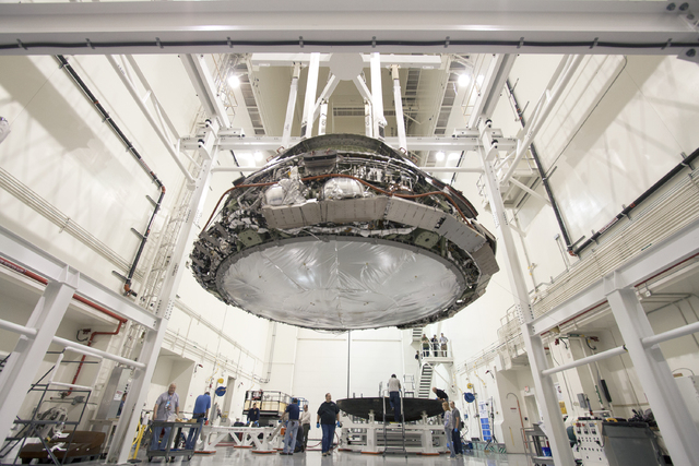 Engineers take a closer look at NASA's Orion spacecraft and its data upon successfully returning to earth from its flight test in December, 2014. (Courtesy NASA)