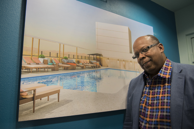Interior designer Brian Thornton poses for a photo in front of a 3D rendering he created of the Radius Pool inside the Stratosphere hotel-casino in Las Vegas on Friday, May 29, 2015. (Martin S. Fu ...
