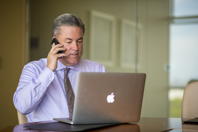 Mike Ballard of Ballard Consulting takes a phone call in a conference room at his office in Henderson on Thursday, May 14, 2015. (Joshua Dahl/Las Vegas Review-Journal)