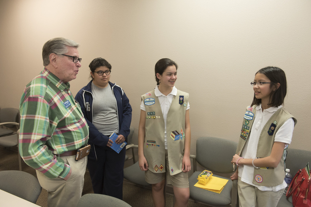 Michael Luckman of SCORE, left, speaks with Isabella Ho, right, and Ashley de la Garza, second from right, about the Girl Scouts of Southern Nevada CEO in Training program at the Urban Chamber of  ...