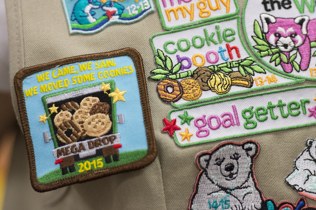 Ashley de la Garza's badges related to Girl Scout Cookies are seen on her vest following a presentation about the business of Girl Scout Cookies and the Girl Scouts CEO in Training program at the  ...