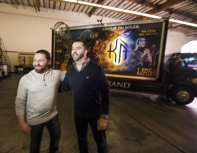 Managing partners Shaun Habibian, left, and Jeremie Watkins stand in front of a custom 3D build-out mobile billboard for “KÀ” by Cirque du Soleil in a warehouse at Kre8 Media Outdoor Advertis ...