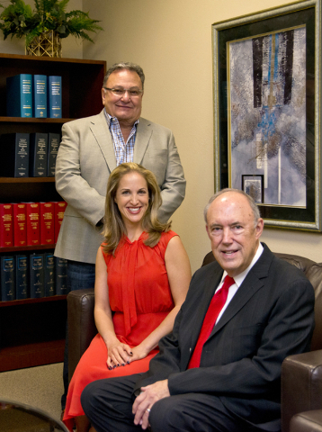 Attorneys Jeff Silver and Kate Lowenhar, left pose for a photo with Vic Salerno at the Dickinson Wright law offices in Las Vegas on Friday, June 24, 2016. Daniel Clark/Las Vegas Review-Journal Fol ...