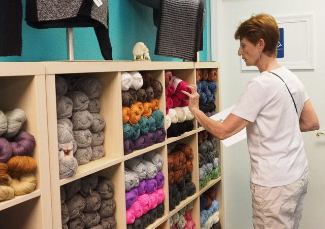 Nancy Dumont, of Las Vegas, searches for yarn at the grand opening of the Mirage Fiber Arts store. (Jerry Henkel/Las Vegas Review-Journal)