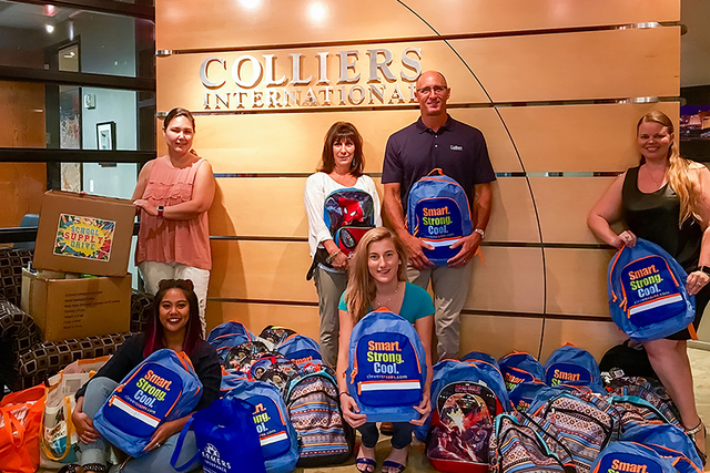 Colliers brokers and employees gathered supplies and donated funds for Tanaka Elementary. (Courtesy)