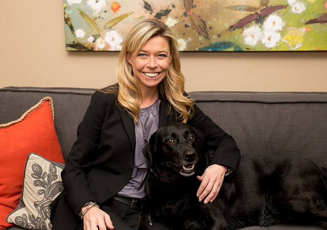 Family law attorney Corinne Price shares her office with a rescued Labrador named Dolly, who helps her child clients feel more at home. (TONYA HARVEY/LAS VEGAS BUSINESS PRESS)