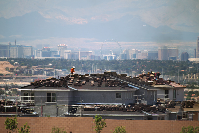 Workers are seen on the roof of an under-construction house in the Cadence, a master-planned community in Henderson. (Sam Morris/Las Vegas Business Press)