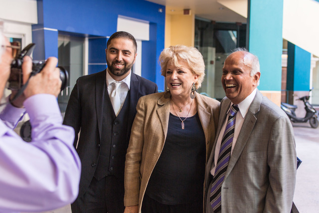 Minister and Little Neon Chapel owner Ben Silvano, left, poses for a photo with Mayor Carolyn Goodman, center and Rohit Joshi during the Chapel's grand opening at Neonpolis July 5. (Elizabeth Brum ...