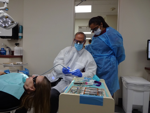 Dr. Philip Devore, DDS, associate professor at UNLV's School of Dental Medicine works with student Kristine San Diego on a patient at the school's UNLV Dental Clinic. (Craig Ruark/Las Vegas Busine ...