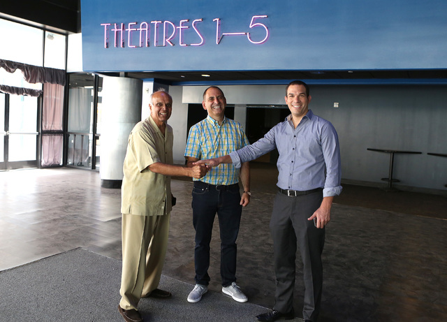 Alex Igelman, CEO, Millennial Esports, center, Rohit Joshi, left, and Las vegas attorney, Ofir Ventura pose for a photo inside Neonopolis' movie theater on Fremont St. on  Sep. 1. (Bizuayehu Tesfa ...