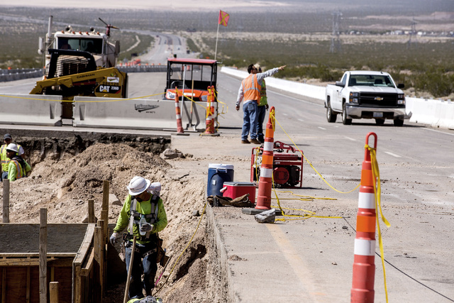 Men work on the Interstate-11 Boulder City Bypass overpass under construction at U.S. 95 on Monday, July 18, 2016.The 12.5 miles of freeway is scheduled to open in late 2018. Jeff Scheid/Las Vegas ...