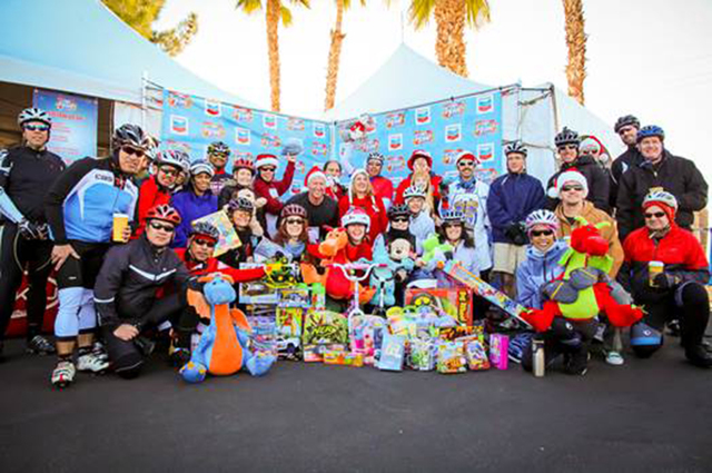 Past years’ riders donate toys to Help of Southern Nevada for 98.5 KLUC’s Chet Buchanan & The Morning Zoo toy drive. (Courtesy)