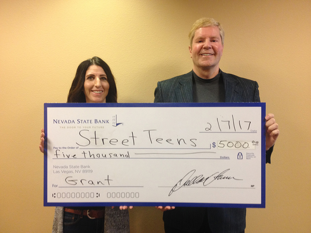 Lisa Preston, executive director of Street Teens, with Drew Zidzik, senior vice president, CRA manager for Nevada State Bank. Nevada State Bank presented a check for $5,000 to Street Teens, a volu ...