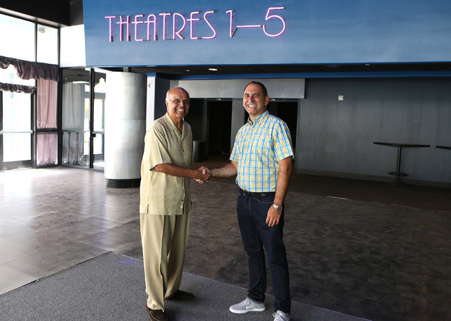 Rohit Joshi, left, shake hands with Alex Igelman, CEO of Millennial Esports inside Neonopolis' movie theater  Sep. 1, 2016. (Bizuayehu Tesfaye/Las Vegas Business Press)