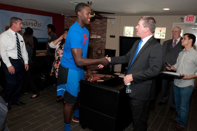 Las Vegas Sands Senior Vice President of Global Communications and Corporate Affairs Ron Reese shakes hands with a client from the Nevada Partnership for Homeless Youth.

Photo Credit: Las Vegas S ...