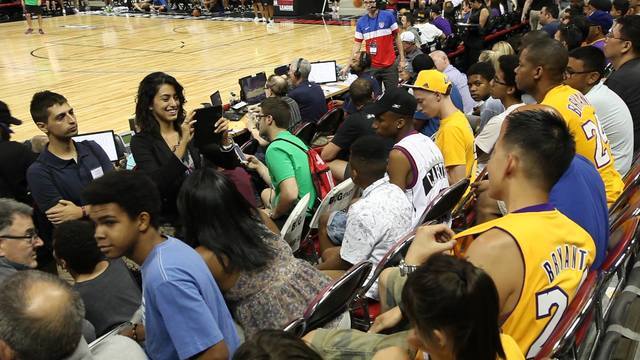 Students in the business class work on social media programs for players in the NBA Summer League. Courtesy