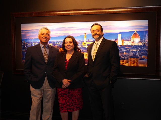 Joe Hernandez, left, president of the Nevada Hispanic Business Group, meet at the William Carr Gallery at Tivoli Village with Laura Nowlan, executive director at NHBG, and Orlando Gallegos, vice p ...