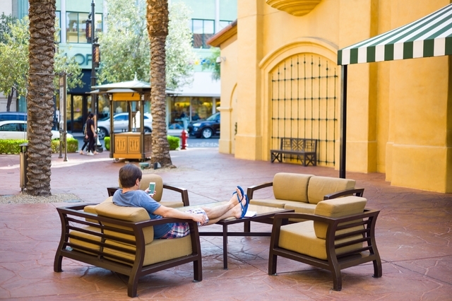 A man relaxes at Town Square in Las Vegas. Chase Stevens/Las Vegas Review-Journal Follow @csstevensphoto
