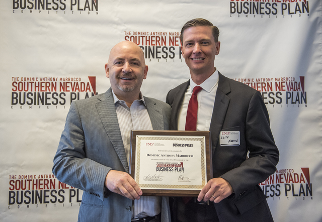Dominic Anthony Marrocco, left, receives a certificate from Director of UNLV Center of Entrepreneurship Leith Martin, Ph.D. during the 8th annual Dominic Anthony Marrocco Southern Nevada Business  ...