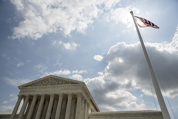The U.S. flag flies in front of the Supreme Court in Washington,  in this  May 18, 2015 file photo.  REUTERS/Joshua Roberts/Files