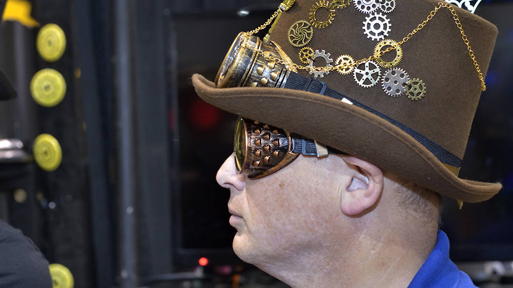 Judge Michael Goeringer watches teams work in the staging area at the FIRST Robotics regional competition. (Bill Hughes/Las Vegas Business Press)