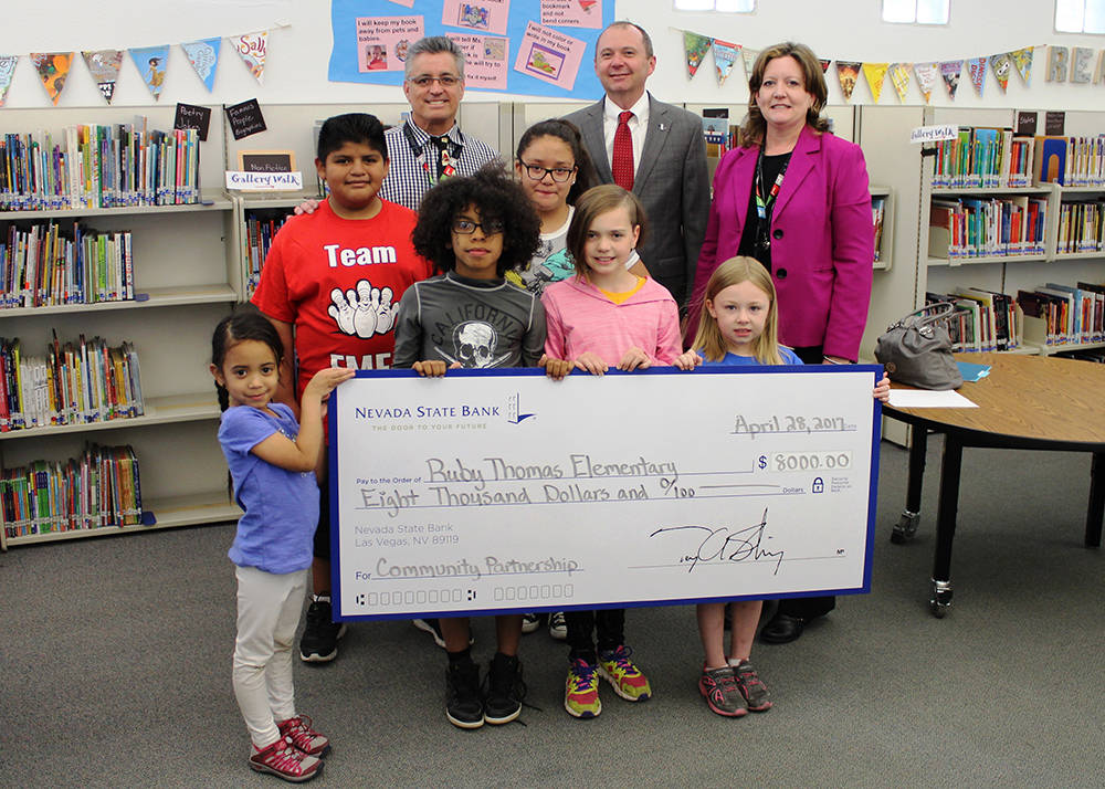 Nevada State Bank presented a check for $8,000 to Ruby Thomas Elementary School April 28, in celebration of Teach Children to Save and to support the school’s education efforts. L to R: Dennis K ...
