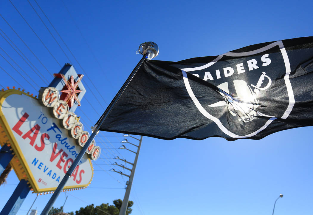 A Raiders flag blows in the wind during a draft day party for the Raiders. (Brett Le Blanc Las Vegas Business Press)