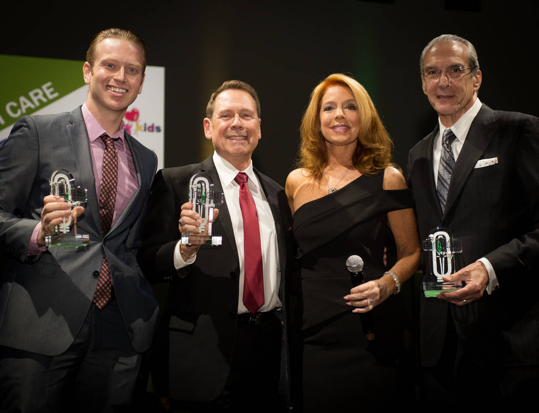 Health care winners, left to right: Southwest Medical Associates Chief Operations Manager Travis Koput, Foundation for Positively Kids CEO Fred Schultz, MC Kelly Clinton Holmes, Cleveland Clinic L ...