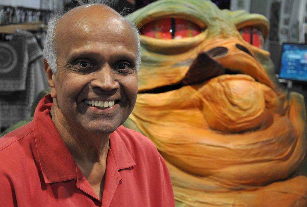 Joshi Rohit of Joshi and Associates sits on a prop depicting Jabba the Hutt - a crime boss in the Star Wars anthology -  at RECon 2017 in the Las Vegas Convention Center and Westgate Hotel, May 21 ...