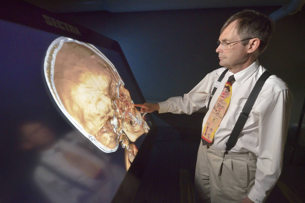 Dr. Jeffrey Fahl, professor of pediatrics and chair of the department of anatomy, demonstrates the Sectra virtual anatomy table at the UNLV School of Medicine on Shadow Lane April 20. (Bill Hughes ...