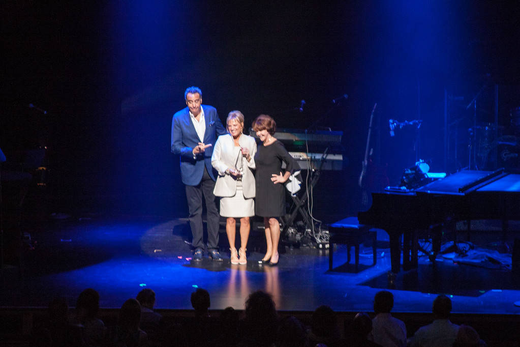 Comedian Brad Garrett and Nathan Adelson Hospice President and CEO Carole Fisher, right, present Kelly E. LeGrow the 2017 Brad Garrett Humanitarian Award. (Courtesy)