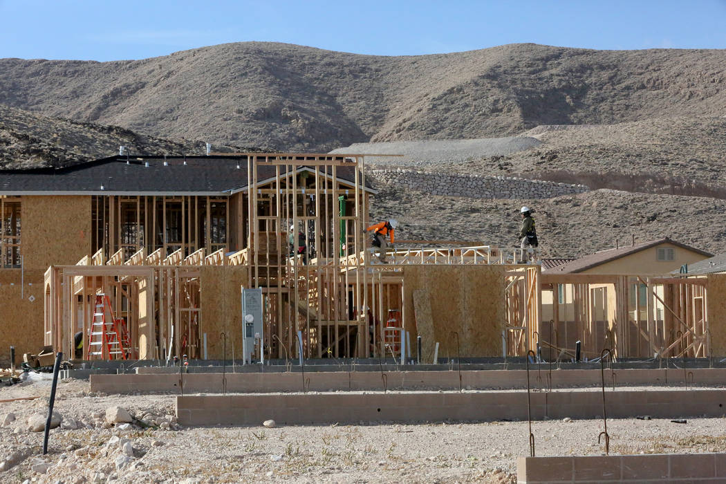 Construction workers put up new homes at Legends, a Lennar development in the Southern Highlands community on Nov. 3. (Michael Quine Las Vegas Business Press)