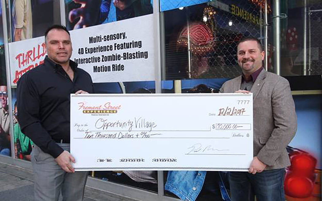 On Dec. 5, Fremont Street Experience, the five-block entertainment district in historic downtown Las Vegas, presented Opportunity Village with a check for $10,000 in honor of the 13th annual Las V ...