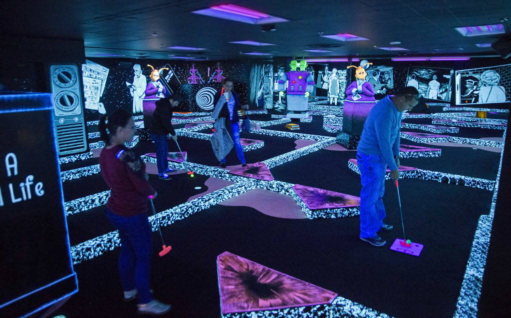 Golfers play at the new The Twilight Zone by Monster Mini Golf Dec. 6 at Bally's. (Benjamin Hager Las Vegas Business Press)