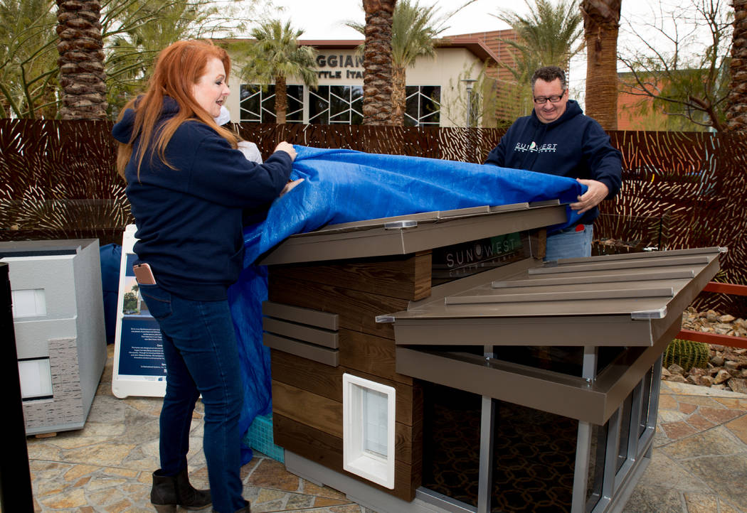 Southwest Custom Homes designers Patty and Carl Martinez designers unveil their entry at the March 20 "Barkitecture" event. (Tonya Harvey Las Vegas Business Press)