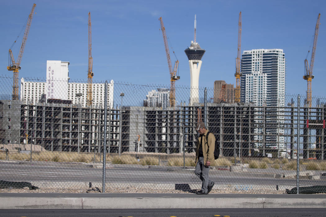 A man walks past the under-construction Resorts World Las Vegas project near the Strip on Jan. 14. (Richard Brian Las Vegas Business Press)
