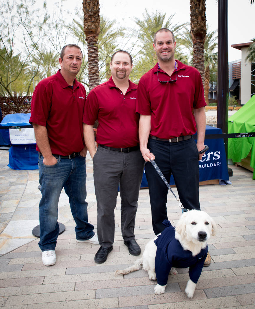 From left, Dave Allen, Jason Willoby, Steve Caprio and his dog, Dunkin, represent Toll Brothers at the "Barkitecture" event March 20. Southern Nevada Home Builders Association members built doghou ...